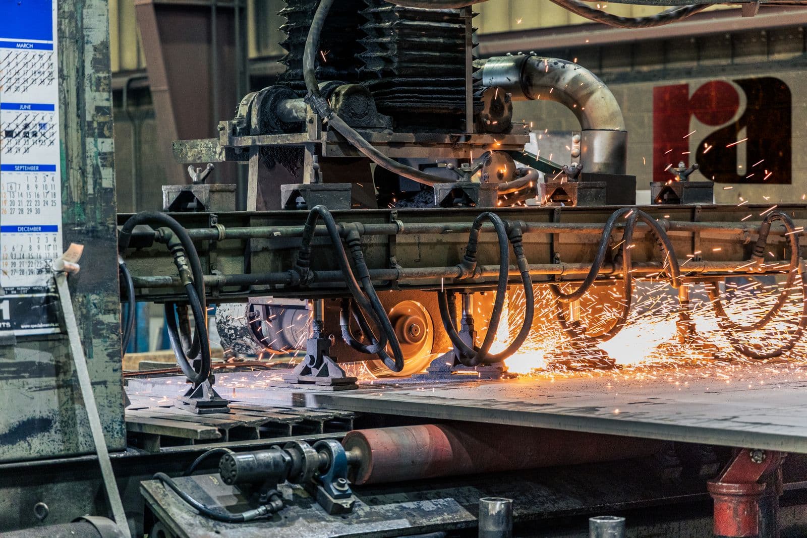 Active manufacturing floor with production machinery, where ICPE installs and relocates lines.