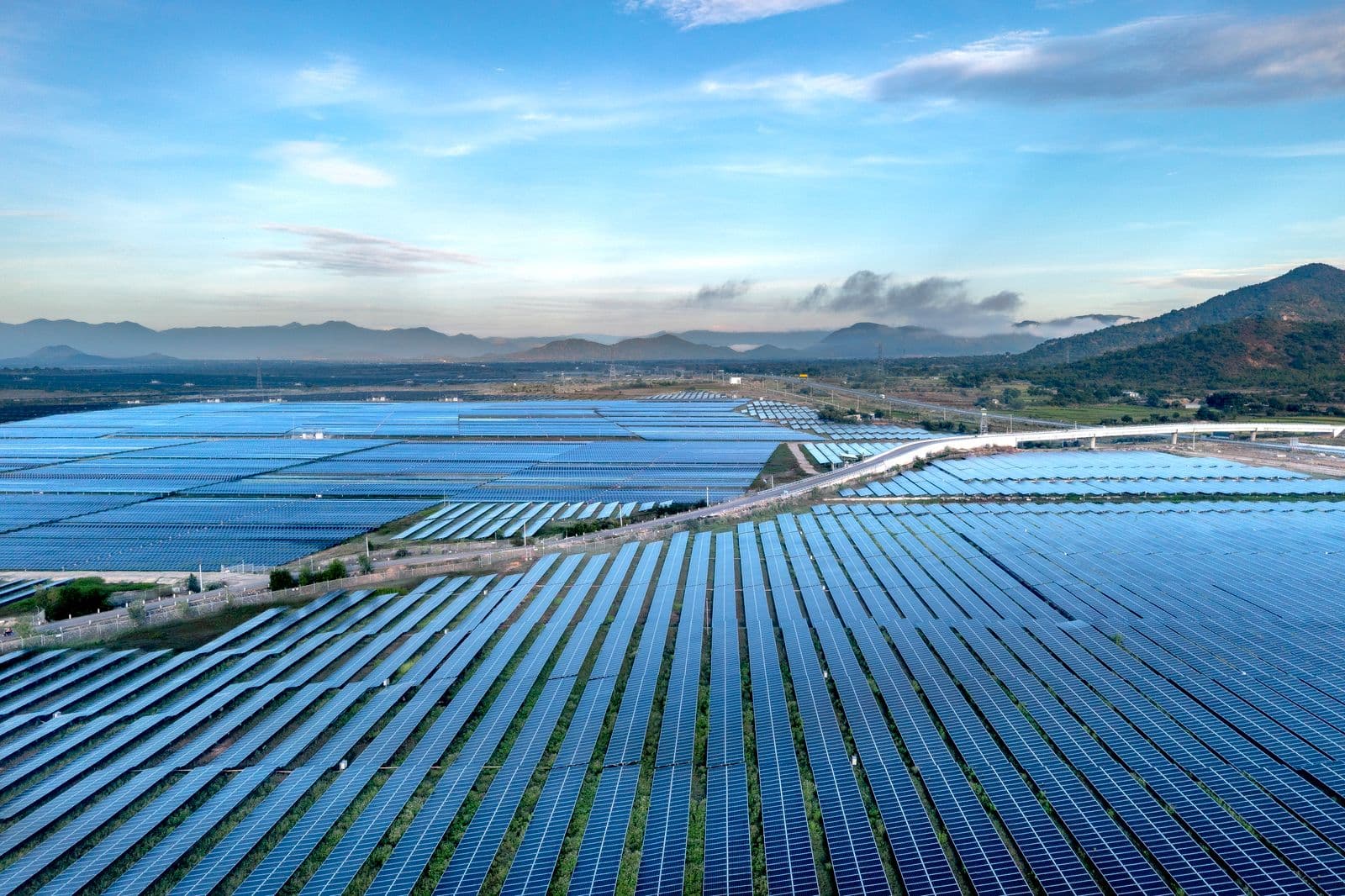 Wind turbines across western terrain, renewable infrastructure ICPE engineers.