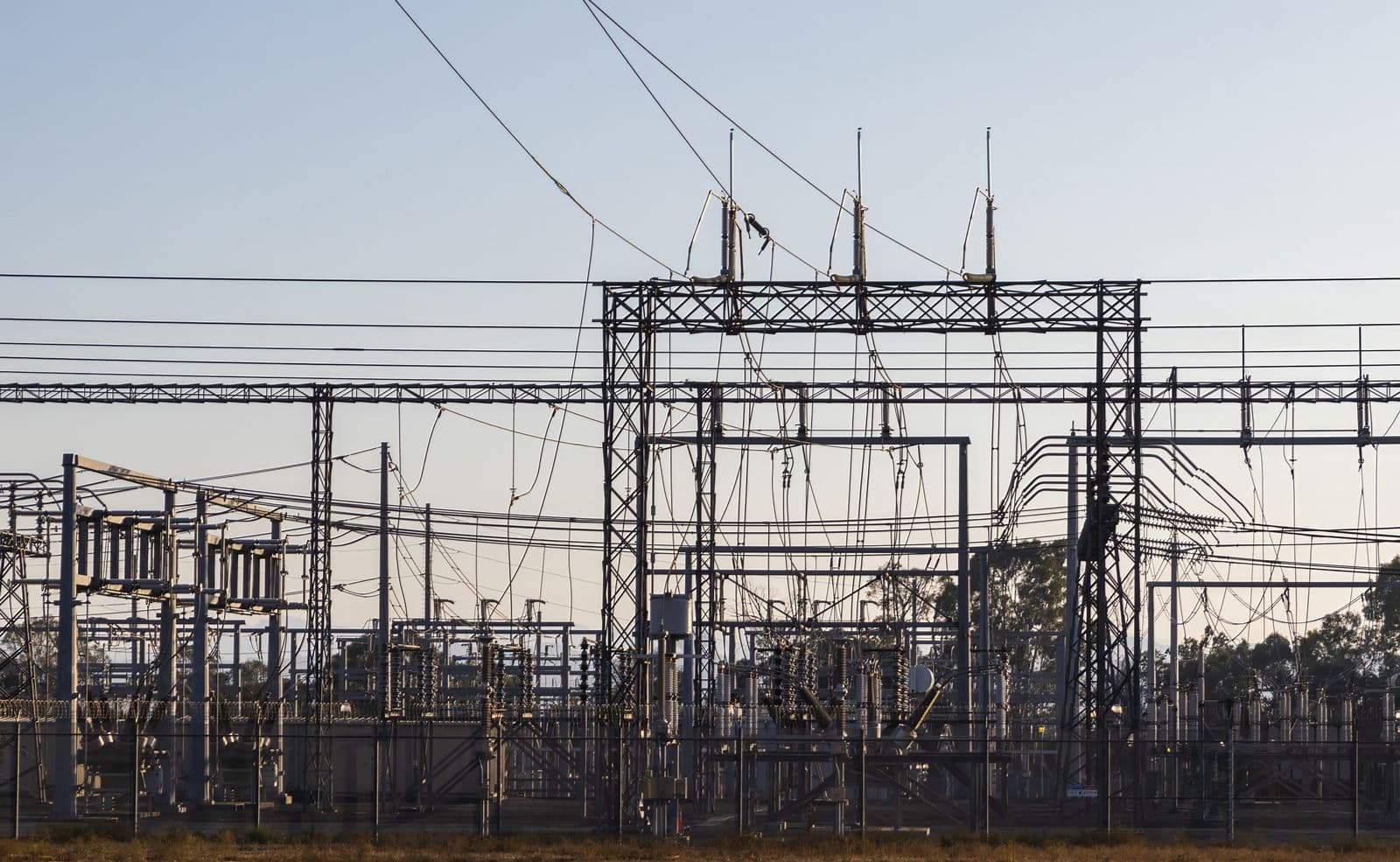 High-voltage substation steel structures and bus work at dawn, core territory for ICPE utility engineering.