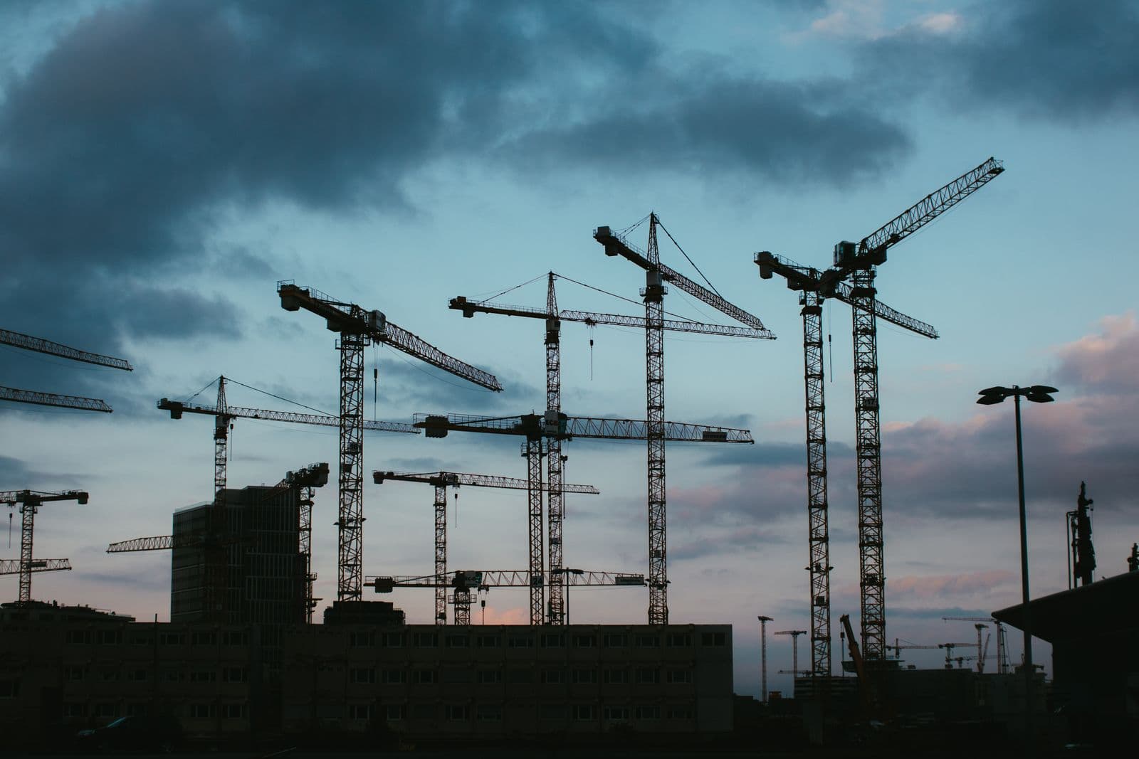 A crane over an industrial construction site.
