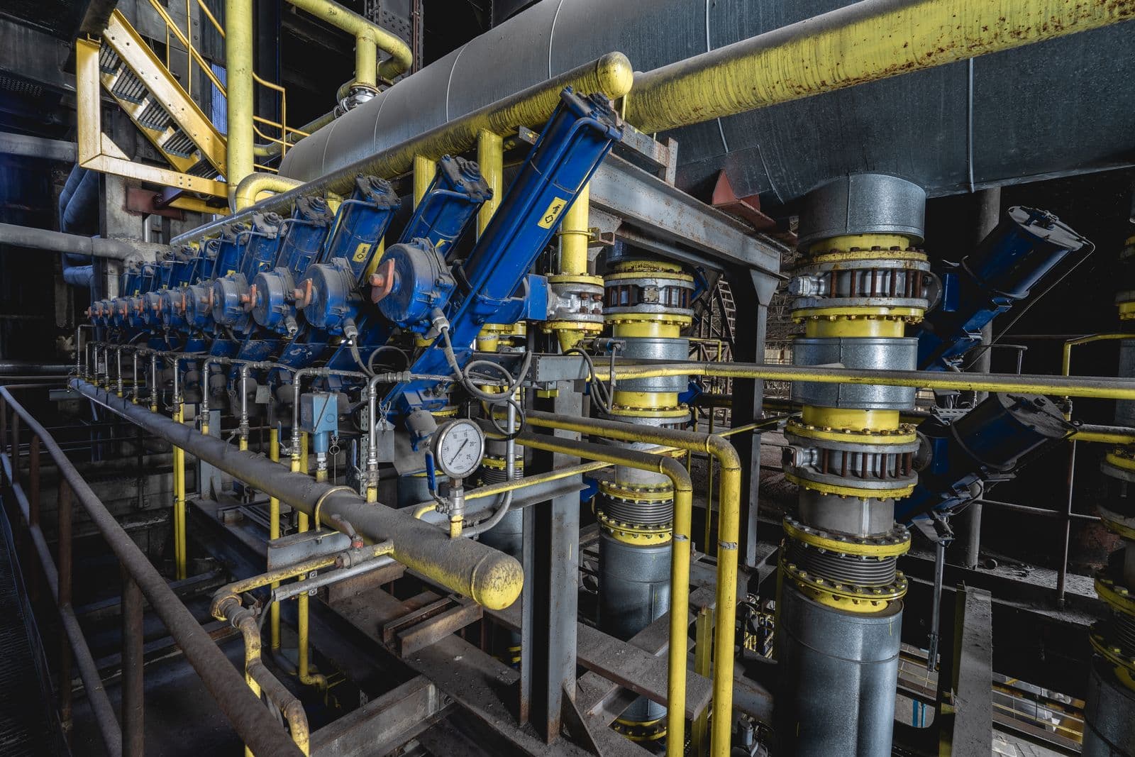 Industrial piping and mechanical equipment inside an operating plant.