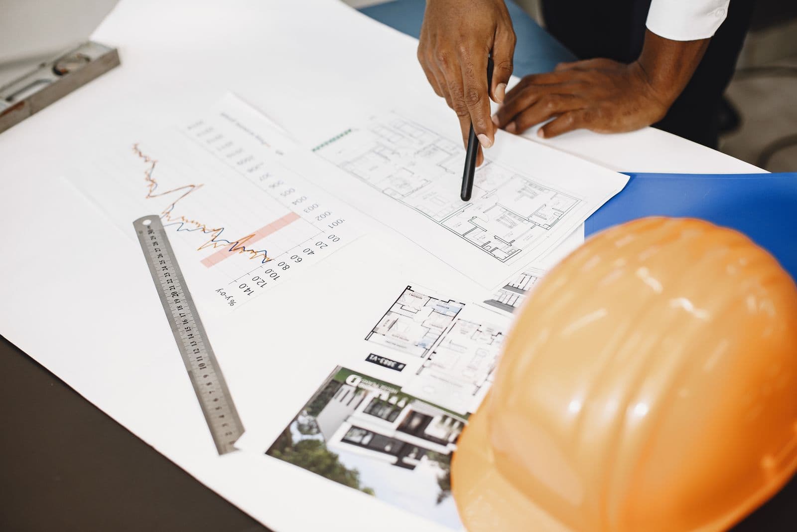 Engineering drawings and takeoff work on a desk.